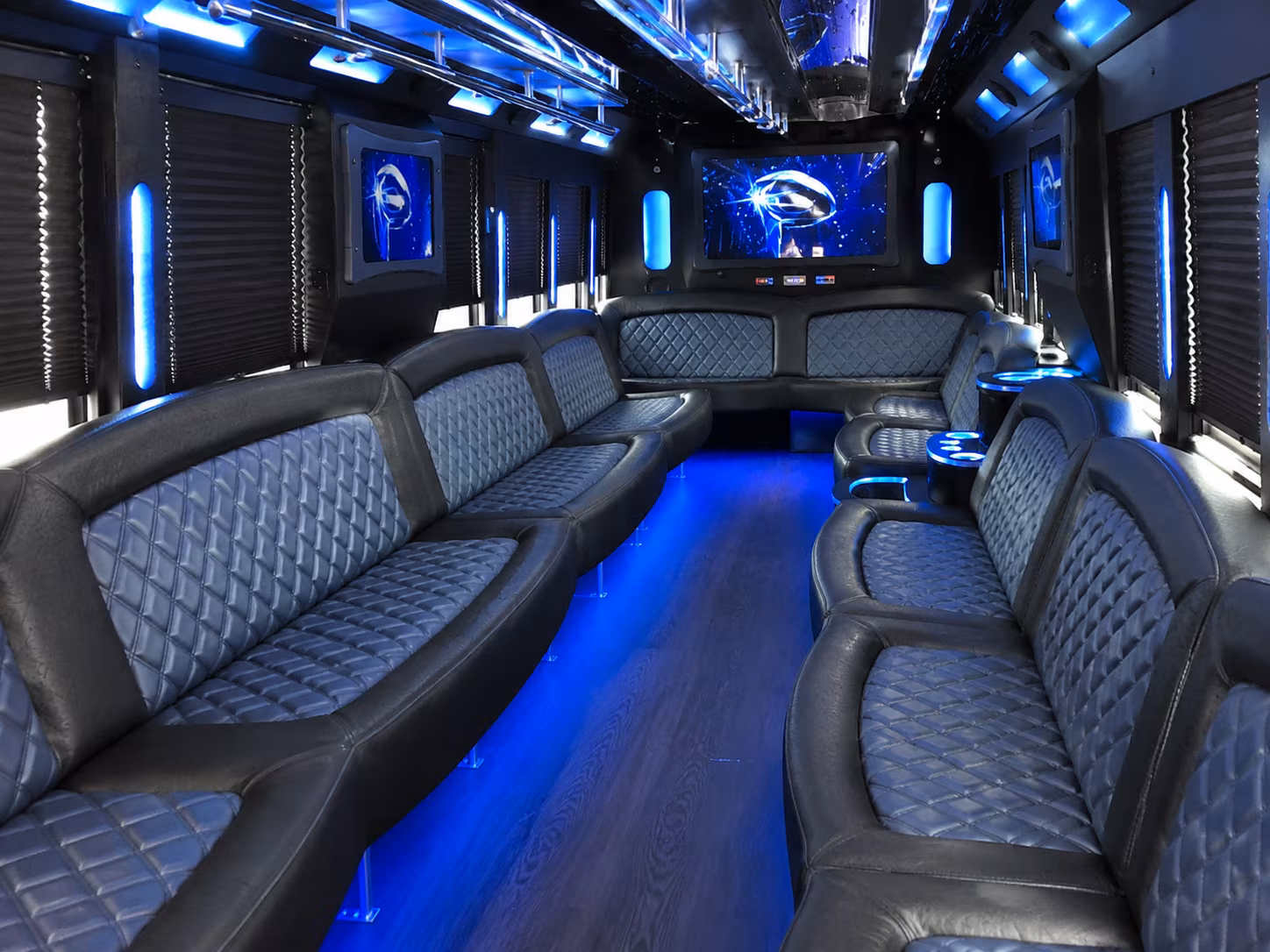 Friends laughing during a party bus celebration in Aurora